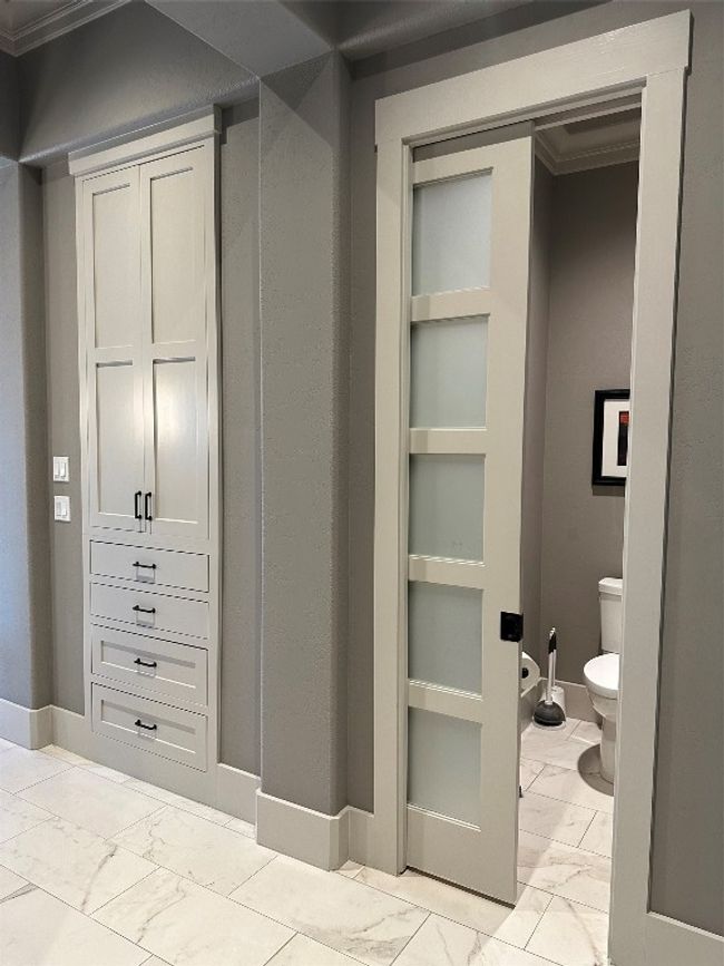 Primary commode with pocket door. Extra storage inside as well. | Image 22