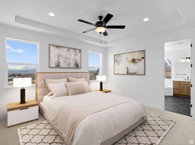 Bedroom featuring carpet, baseboards, connected bathroom, recessed lighting, and a raised ceiling | Image 4