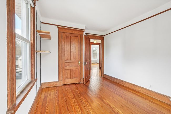 Unfurnished room with light wood finished floors and baseboards | Image 15