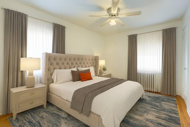 Bedroom with wood finished floors and a ceiling fan | Image 27