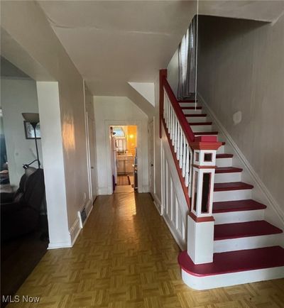 Staircase featuring parquet floors | Image 2