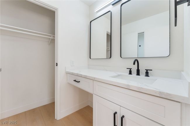 Bathroom featuring wood finished floors and vanity | Image 33
