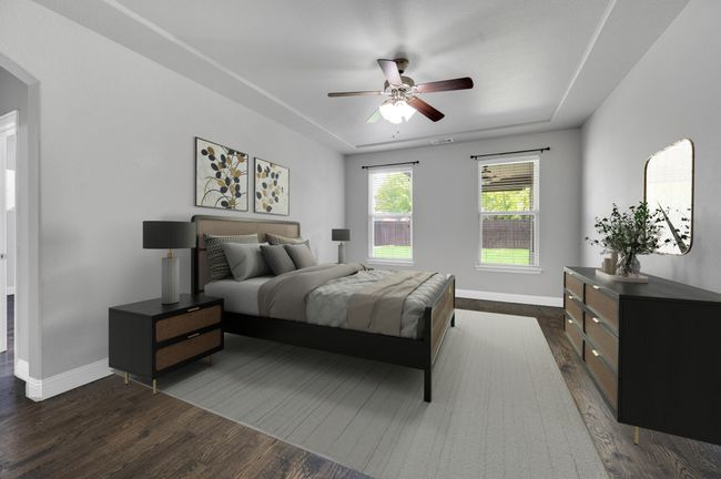 First floor master bedroom is a great size with natural light, wood floors, private bath and closet. | Image 14
