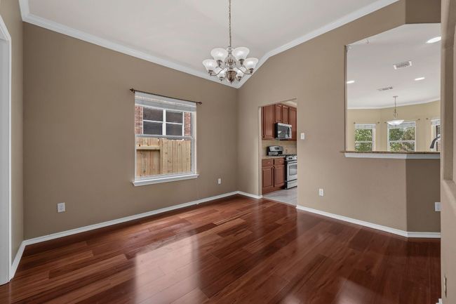 Enjoy both formal and casual dining with a dedicated dining room and a charming breakfast nook. | Image 14