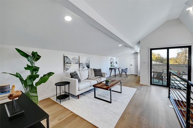 Living room with wood-type flooring and lofted ceiling | Image 14