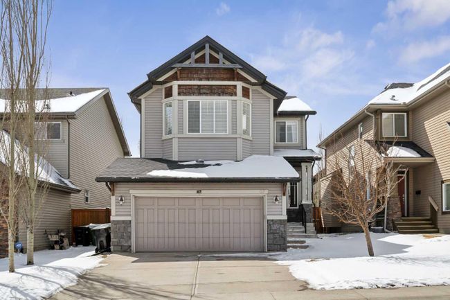 67 Tremblant Way Sw, Home with 3 bedrooms, 2 bathrooms and 2 parking in Calgary AB | Image 1