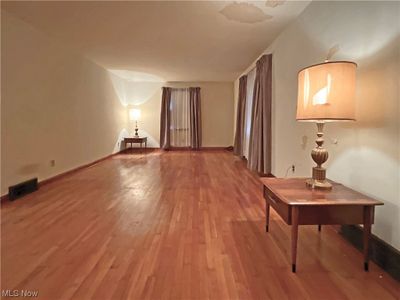 Unfurnished room featuring hardwood / wood-style flooring | Image 2