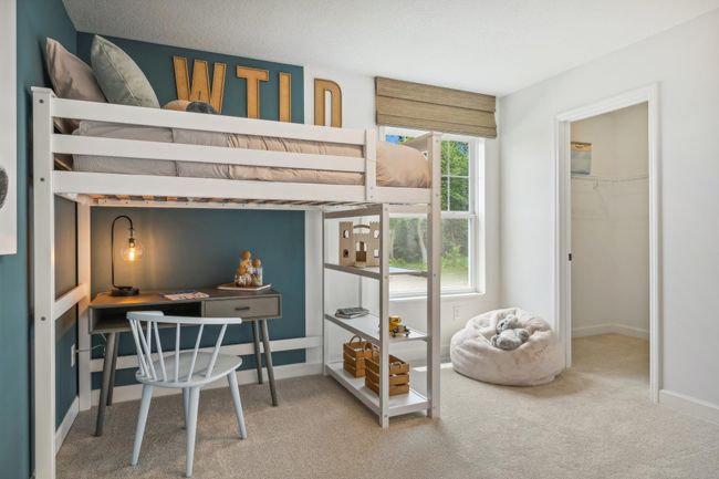 Photo is of the actual model. The third generously sized upper level secondary bedroom with a spacious closet. | Image 20
