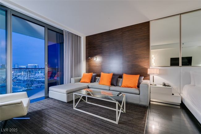Living room featuring hardwood / wood-style flooring and expansive windows | Image 10