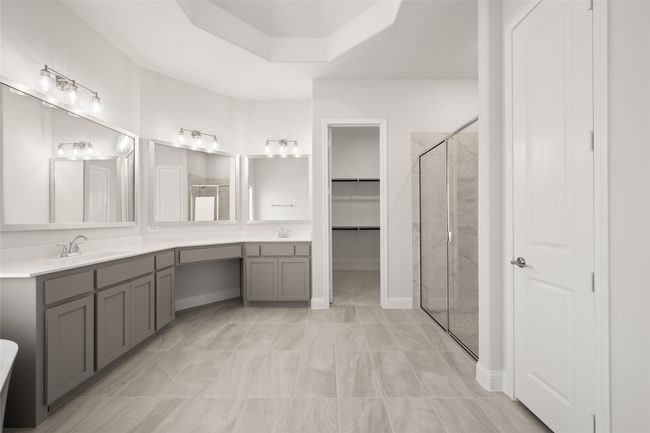 Bathroom with a shower stall, double vanity, and a walk in closet | Image 16