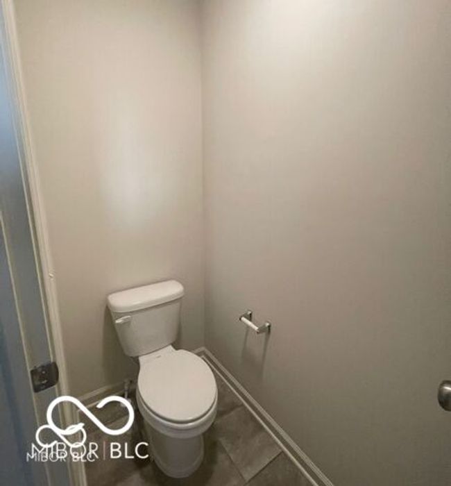 bathroom featuring toilet, tile patterned flooring, and baseboards | Image 17