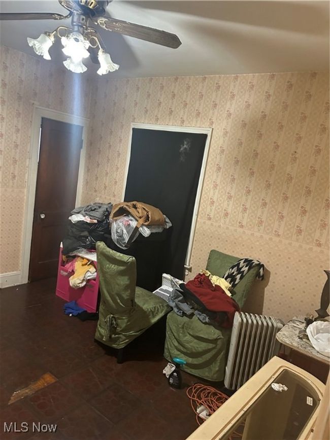 Misc room featuring a ceiling fan and wallpapered walls | Image 14