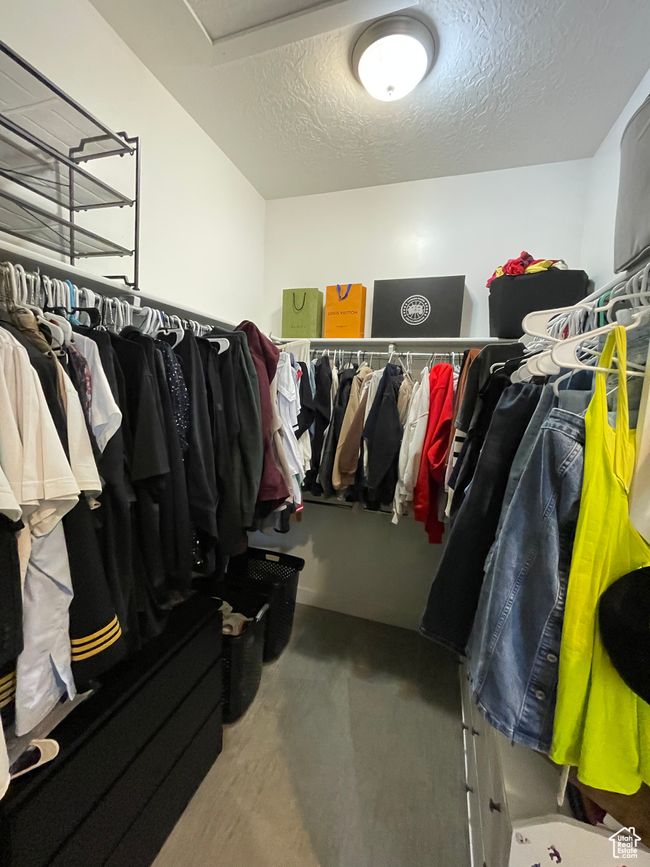 Walk in closet with carpet flooring | Image 36