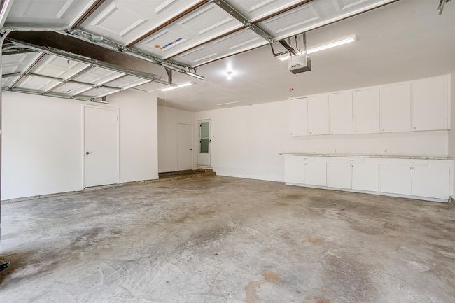 Garage with a garage door opener | Image 33