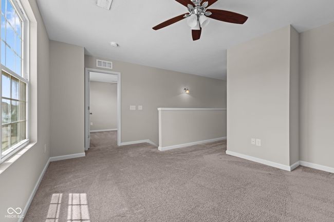 Loft w/plenty of natural light, and a ceiling fan | Image 13