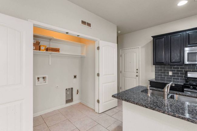 Laundry closet with gas or electric dryer hookup and washer hookup. *Water is included in the monthly rent.* | Image 32