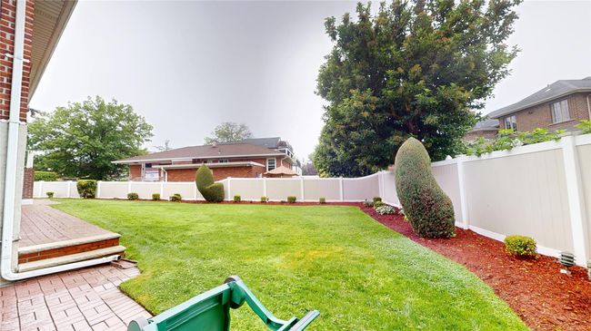 View of fenced backyard | Image 22