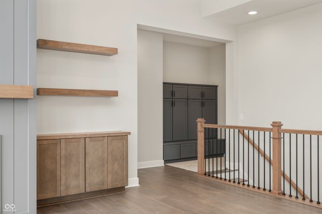 Boot bench excellent for storage, leading to the stairway to finished basement. | Image 14