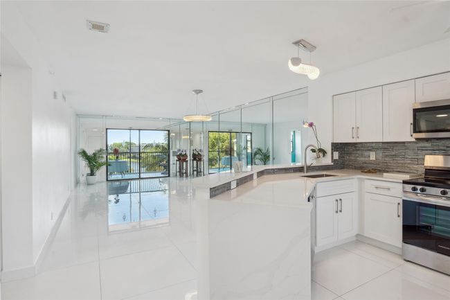 Upon entry, you have full view of living room & kitchen as well as balcony | Image 15