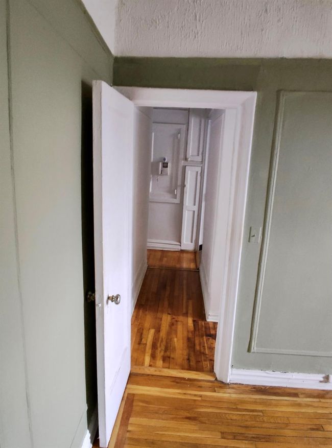 Hallway featuring light wood finished floors | Image 13