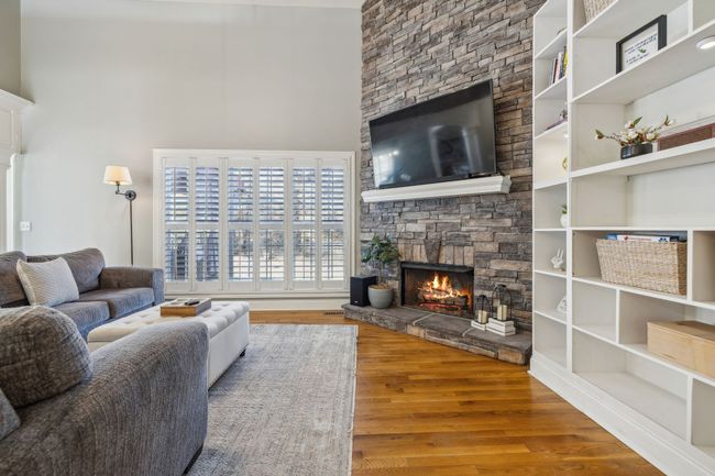 Check out this beautiful stacked stone fireplace! Many cozy days have been enjoyed in this room. | Image 22