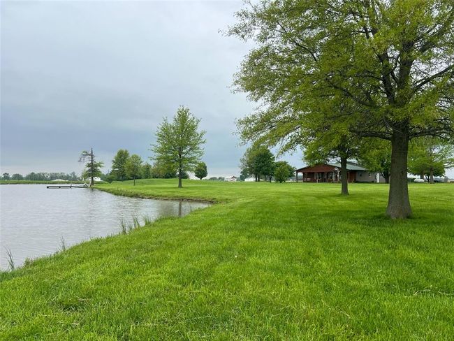 View of green lawn with a water view | Image 27
