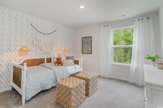 Bedroom with wallpapered walls, baseboards, and light colored carpet | Image 21