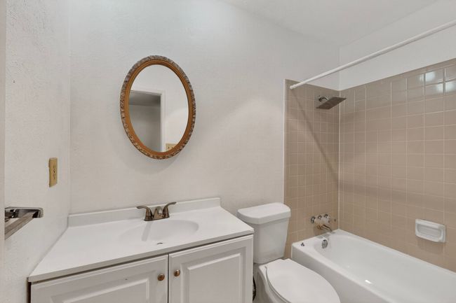 Full bathroom featuring vanity and bathtub / shower combination | Image 11