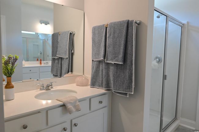 Bathroom with a stall shower and vanity | Image 20