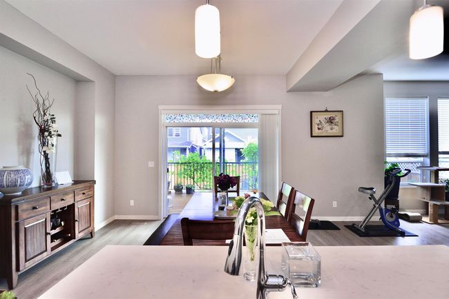 Dining room featuring wood finished floors and baseboards | Image 11