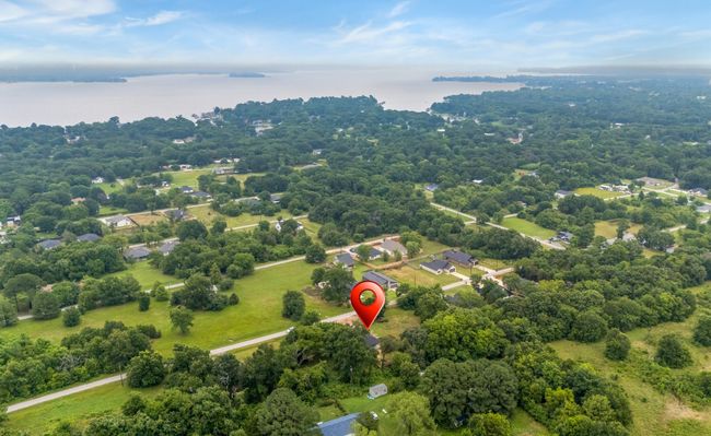 Bird's eye view of a nearby body of water and a heavily wooded area | Image 36