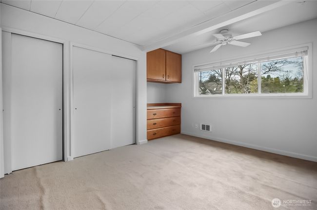 Ceiling fan & bright windows. | Image 19
