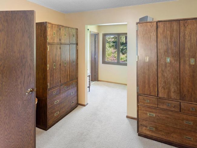 Dressing area with large walk-in closet | Image 27