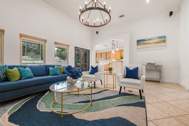 Open concept living with fresh paint and new light fixtures. | Image 4
