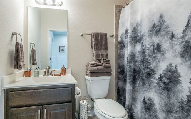 Second full bathroom upstairs that is located off the second living area. | Image 17
