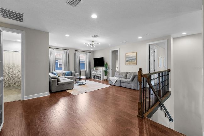 Upstairs secondary TV room with new flooring | Image 25