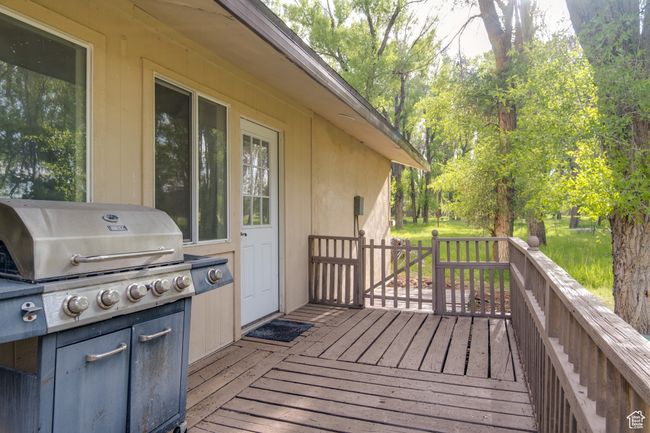 Wooden deck with a grill | Image 10