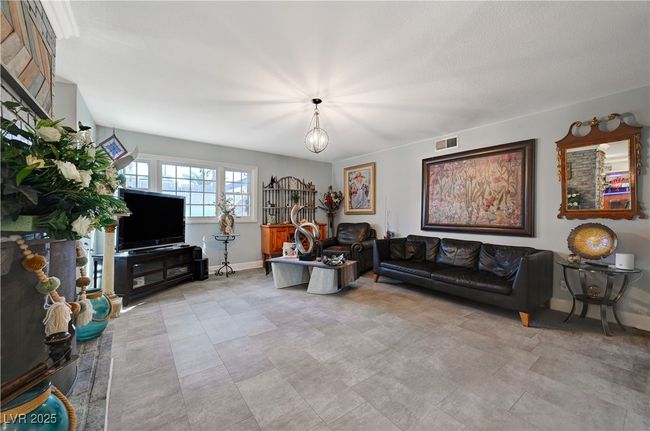 Living area featuring baseboards | Image 30
