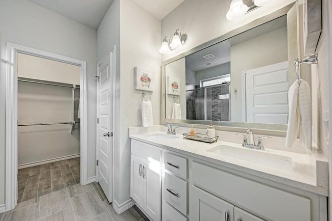 Master Bathroom ensuite with double vanity, a spacious closet | Image 13