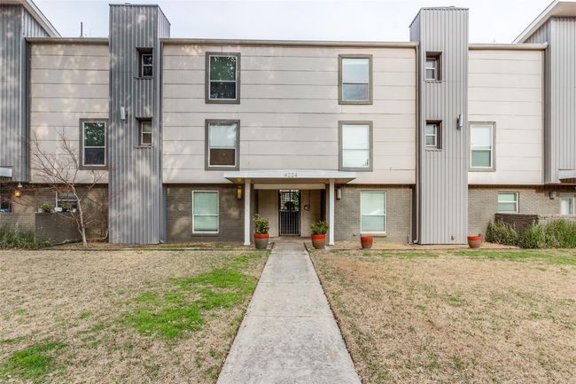 Townhome / multi-family property with brick siding and a front yard | Image 16