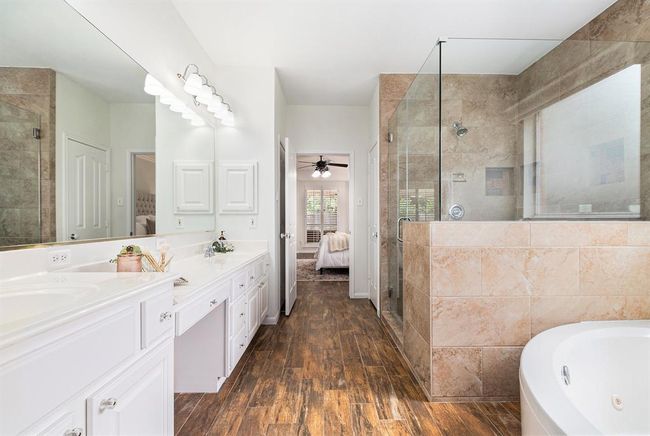 This view shows the grand size of the shower and the ample countertop space too! | Image 15
