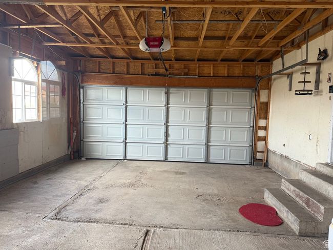 Garage featuring a garage door opener | Image 30