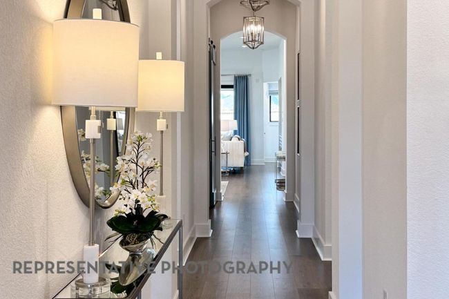 Hall featuring dark wood-type flooring and arched walkways | Image 28