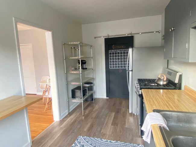 Cute chalk board barn door conceals the rear access door | Image 11