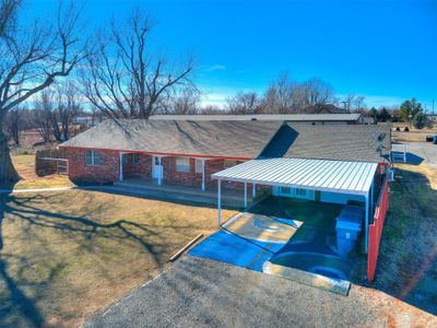 View of front of house featuring a carport and a front lawn | Image 2