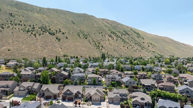 Aerial view of residential area featuring a mountainous background | Image 32
