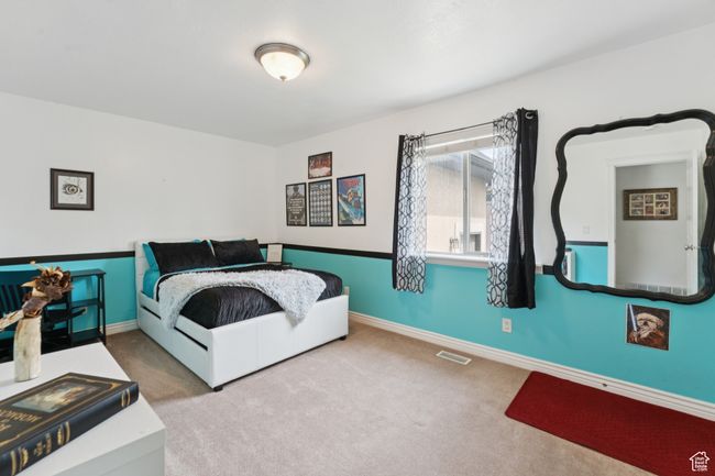 Carpeted bedroom with baseboards | Image 20