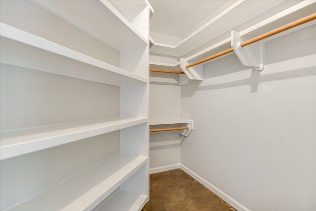 Nice walk in closet in the Primary with 'princess' shelving added. There's even an AC vent in the closet. | Image 10