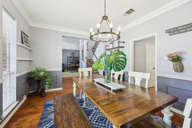 View from the formal dining into the entryway and also connecting to the kitchen. | Image 6