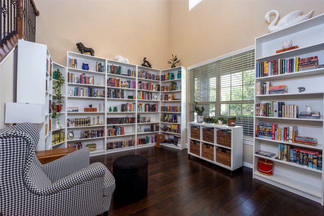 Dining or Sitting room with wood-type flooring and bookshelves | Image 10